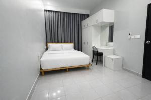 Giường trong phòng chung tại Adam Luxe Homestay Tapah