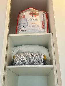 a drawer of a refrigerator with a box and a bag at La Cachette Vigneronne in Givry