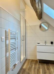 a bathroom with a sink and a mirror at La Cachette Vigneronne in Givry +18 photos