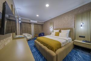 a hotel room with a bed and a couch at HanzadeHotel in Edremit +8 photos