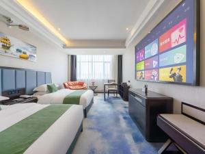 Et tv og/eller underholdning på GreenTree Inn Hami Railway Station Bayi Road