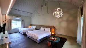 Postel nebo postele na pokoji v ubytování 新光兆豐花蓮旅館