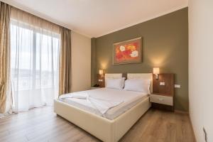 Postel nebo postele na pokoji v ubytování KEIT Hotel