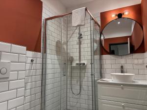 Koupelna v ubytování Hirschenhof Apartments + 46 fotografií