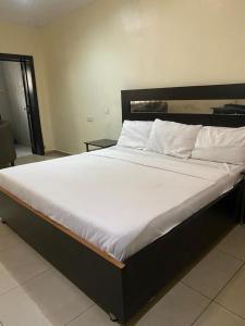 En eller flere senge i et værelse på Funplex Resort