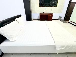 En eller flere senge i et værelse på Trisna Patihan Resort