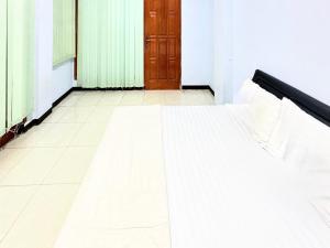 En eller flere senge i et værelse på Trisna Patihan Resort + 25 billeder