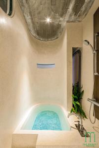 a blue tub in a bathroom with a sink at The Memory Danang Boutique in Da Nang +103 photos