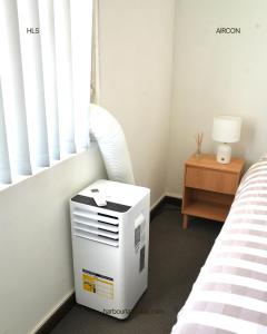 Giường trong phòng chung tại Harbour Lane Stay