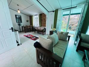a living room with a couch and a table at 35-B-5 Kandy in Kandy