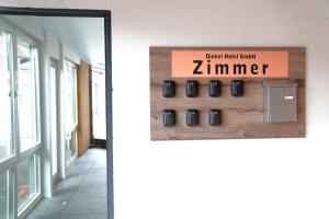 a sign for a zimnt gym in a building at Hotel am Schürblick in Gronau