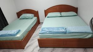 Giường trong phòng chung tại Lapangan Sentosa Homestay Ipoh +16 ảnh