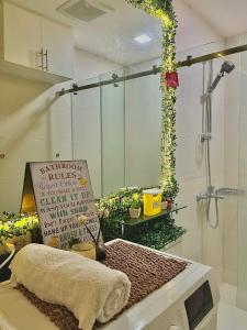 a showroom with a sign in a room with flowers at The Cozy Canopy in San Fernando