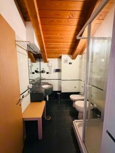 a bathroom with two toilets and a sink at Residence Cianfuran in Bardonecchia +82 photos