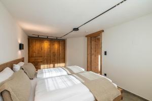 Postel nebo postele na pokoji v ubytování Appartementhaus Moritz + 46 fotografií