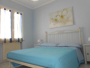A bed or beds in a room at Residence Kimba