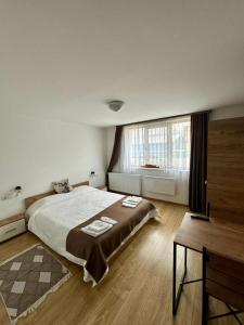 En eller flere senge i et værelse på Casa Cerbului