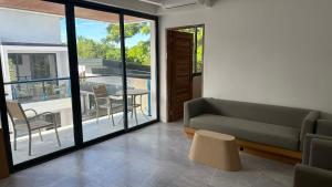 a living room with a couch and a table at Bohol panglao Diver's home resort in Panglao