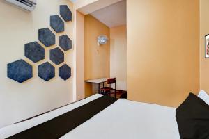 Giường trong phòng chung tại Hotel O Euphoria inn