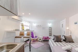 Kuchyň nebo kuchyňský kout v ubytování Apartment Luce Mala