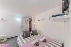 Postel nebo postele na pokoji v ubytování Apartment Luce Mala