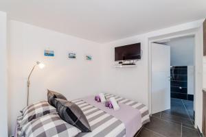 Postel nebo postele na pokoji v ubytování Apartment Luce Mala