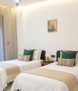 En eller flere senge i et værelse på Azra Mila Appart luxe famille uniquement