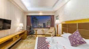 Ένα ή περισσότερα κρεβάτια σε δωμάτιο στο Xiamen Plaza Hotel +220 φωτογραφίες