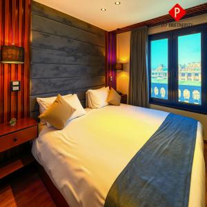 En eller flere senge i et værelse på PYramiDs MaGiC EyE HoTeL