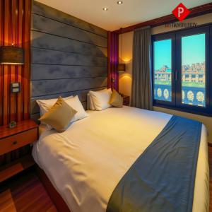 En eller flere senge i et værelse på PYramiDs MaGiC EyE HoTeL