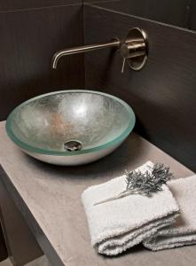 a bathroom sink with a bowl on a counter at House 5 in Trieste
