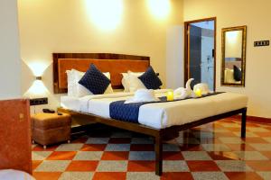 a bedroom with a large bed in a room at The Lake Haveli in Udaipur