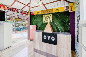 a stage with an oyo sign on it at SPOT ON Parampara Garden Resort in Shamsgarh
