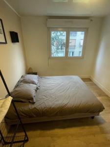 Postel nebo postele na pokoji v ubytování Appartement 2 chambres lumineux à 10 minutes de Paris