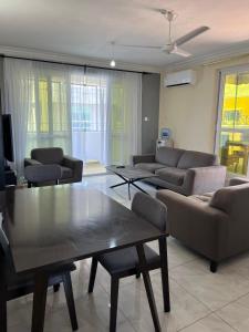 a living room with couches and a coffee table at Goodlifehomes in Mtwapa
