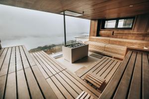 a room with two benches and a large window at Hotel Schachner in Maria Taferl