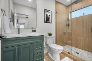 a bathroom with a sink and a toilet and a shower at *Rooftop Deck*Hot Tub*Sauna*Fire Pit*Sunset Views* in Campton +69 photos