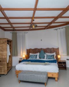 Postel nebo postele na pokoji v ubytování Footprints - Kinigi