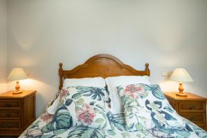 En eller flere senge i et værelse på Apartamento El Fondon 2