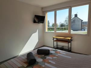 TV a/nebo společenská místnost v ubytování Studio Le Jardin