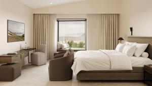 a bedroom with a bed and a desk and a window at 360 Hotel Boutique and Spa in Selfoss
