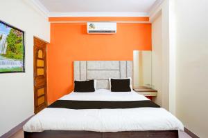 En eller flere senge i et værelse på SPOT ON by OYO Bhedaghat Resort