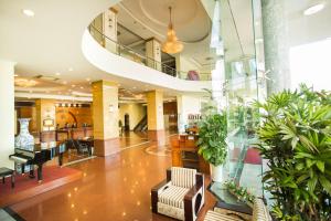 a lobby of a building with plants at Seagull Hotel in Quy Nhon +160 photos