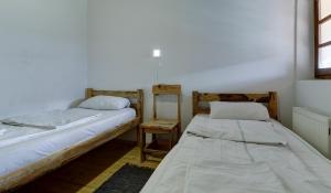 En eller flere senge i et værelse på Srna Etno Selo - Hotel i Restoran