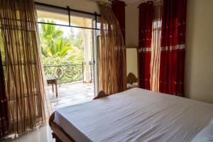 Giường trong phòng chung tại Beachside Apartments Pointe aux Piments +5 ảnh