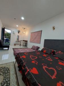 En eller flere senge i et værelse på Granny Palace Pendang Kedah