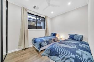 En eller flere senge i et værelse på Luxury on Leeds