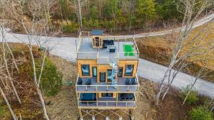 an aerial view of a house in the woods at *Rooftop Deck*Hot Tub*Sauna*Fire Pit*Sunset Views* in Campton