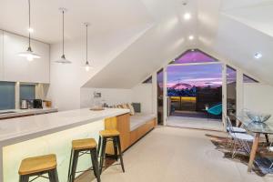 a kitchen and dining room with a view of the city at Cremorne Point Manor in Sydney