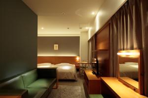 Postel nebo postele na pokoji v ubytování Candeo Hotels Chino + 37 fotografií